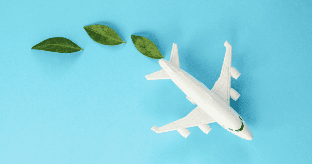 Cartoon airplane with green leaves coming from the emissions, symbolizing eco-friendly travel