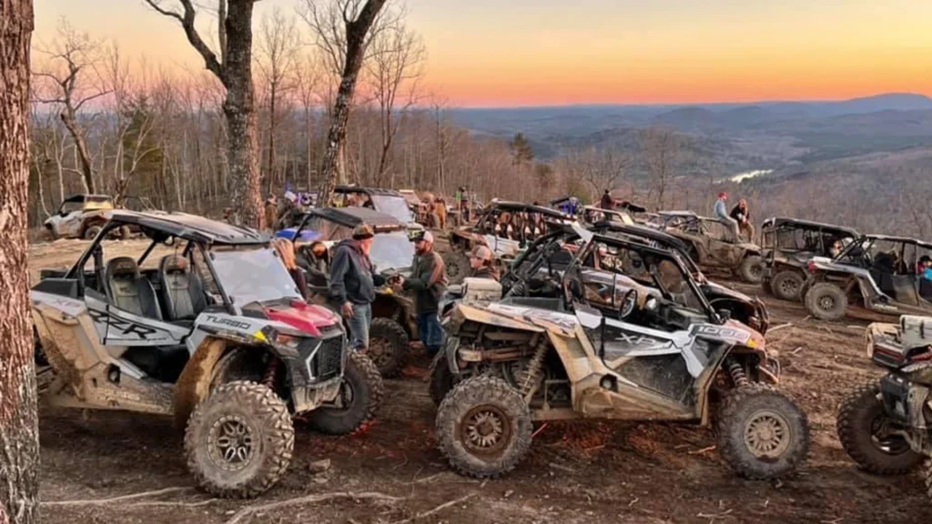 off-road vehicles gather on a scenic overlook, representing the outdoor attractions place marketing agency Red Sage promotes