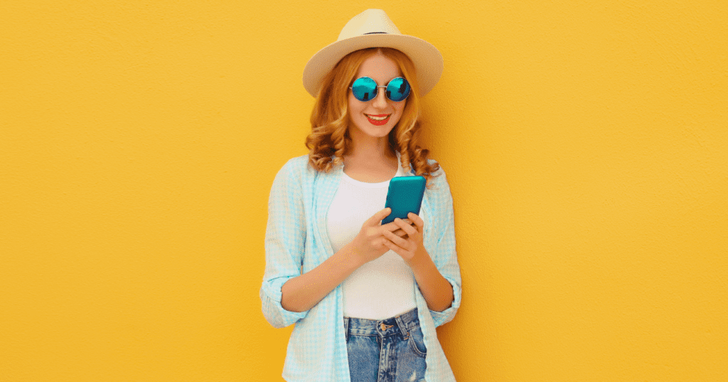 Smiling woman using a smartphone with AI booking travel