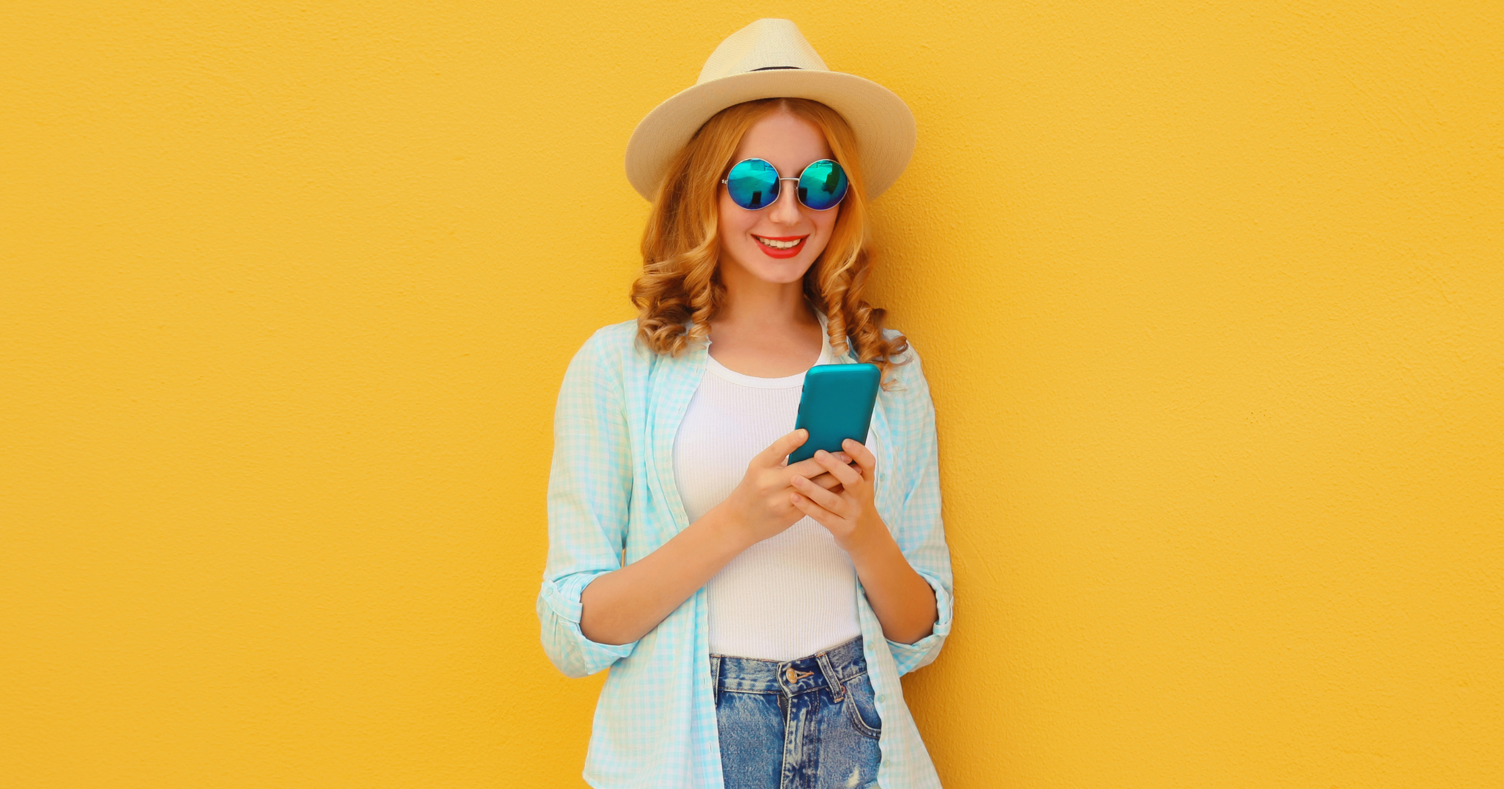 Smiling woman using a smartphone with AI booking travel